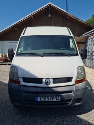 a white van parked in front of a building