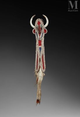 a close up of an animal head hanging from a string