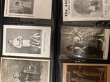 a lot of old baseball cards on display in a glass case