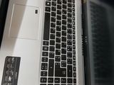 a laptop computer that is open on a table