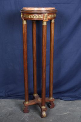 a wooden table with a marble top and two legs