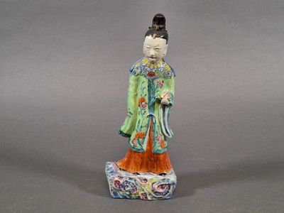chinese figurine of a woman in a green robe and hat