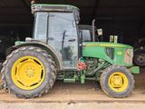 a tractor that is parked in a garage