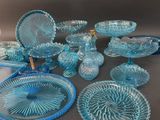many pieces of blue glass on the table