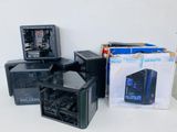 a lot of computer cases that are sitting on a table