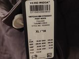 brand new with tags and tags attached to the back of the jacket