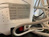a close up of an electrical device with wires attached to it