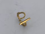 a close up of a gold ring on a white surface