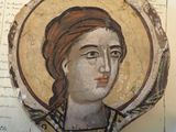 an old painting of a woman with a red head on a piece of paper