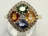 an image of a multi colored diamond ring on a clear stand
