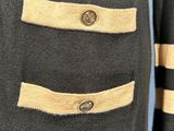a close up of a jacket with two buttons on it