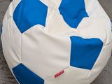 a blue and white soccer ball sitting on the ground
