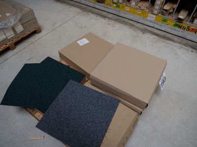 a pile of boxes sitting on the floor in a store