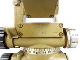 a close up of a gold tripod with numbers on it