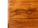 a close up of a wooden table with a white background