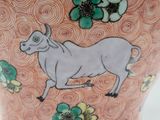 an image of a vase with a cow on it