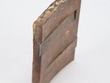 a small wooden door that is open on a white surface