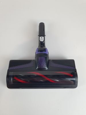 a close up of a vacuum cleaner on a white surface