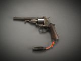 an old gun with a red arrow on the side of it