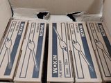 four boxes of pizza sitting in a box on a table