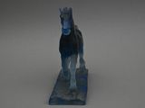 statue of a horse with a blue mane standing on a blue base