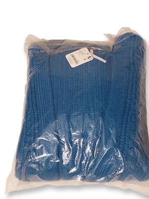 the blue blanket is wrapped in plastic and ready to be used