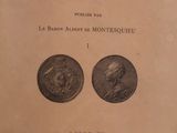 an old book with two coins on it sitting on a table