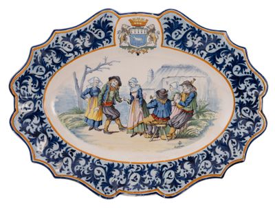 a blue and white plate with a picture of people on it