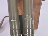 two metal pipes that are sitting next to each other