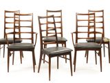 lot de quatre chaises de salle à manger avec assise rembourrée en cuir noir