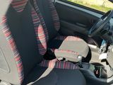 the seat covers are black and red and the seats are grey