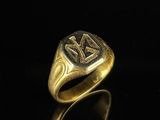 an image of a gold ring with the initials of two men