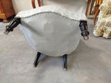 a chair made out of a sheep ' s head and legs