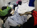 a suitcase full of clothes and a stuffed animal in it