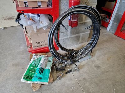 a bike wheel and a hose on the floor