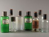 five bottles of different types of alcohol on a table