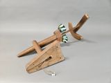 a small wooden object that is sitting on a table