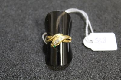 a ring that is sitting on a table with a price tag