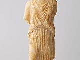 a statue of a woman with a bowl on her head