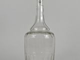 an old fashioned glass decanter with a stopper on the top