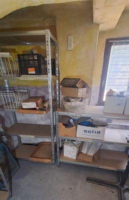 a room that has a lot of boxes on the shelves