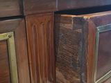 a wooden desk with a drawer on top of it