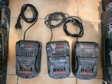 three bosch power tools sitting on top of a tiled floor