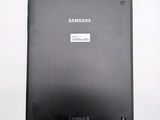 a black tablet with a sticker on it