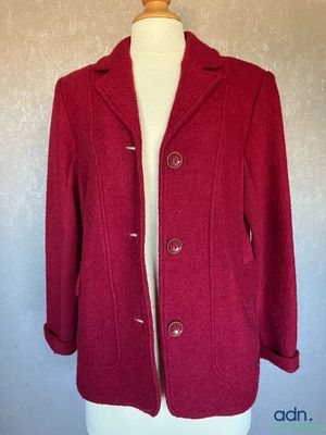 a close up of a red coat on a mannequin mannequin mannequin mannequin mannequin mannequin mannequin manne