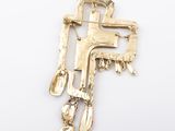 an image of a gold plated brooch with spoons and spoons