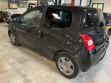 a picture of a small black car in a garage