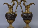 pair of antique bronze and black vases with birds on them