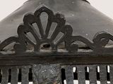 a close up of an old fashioned lamp hanging from the ceiling
