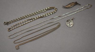 a collection of silver jewellery including a necklace and a pendant